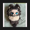 Spooky Eerie Plush Creature with Haunting Eyes