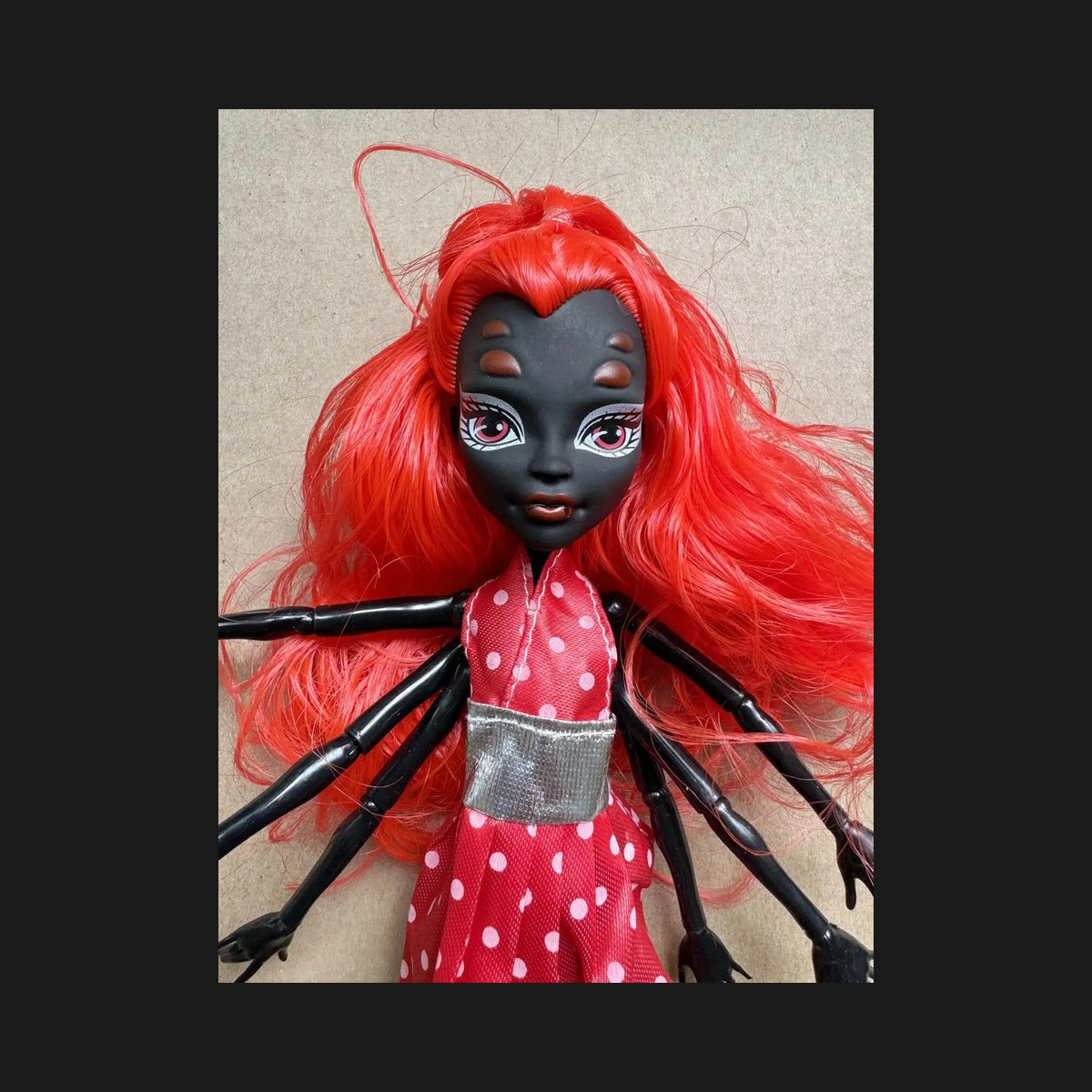 Creepy Eight-Legged Doll with Fiery Red Hair